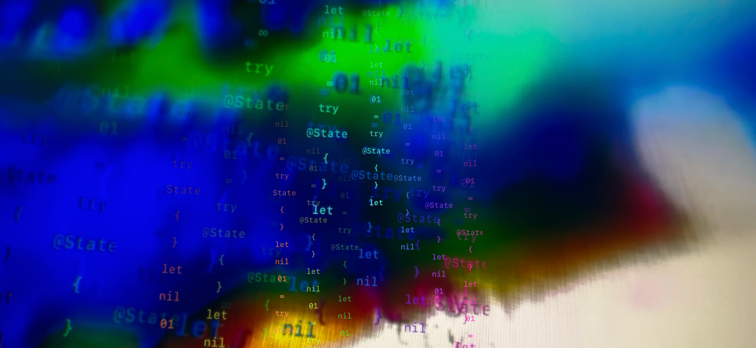 Kleine Textzeichen verschwimmen in grünen, blauen und gelben Farbflächen.